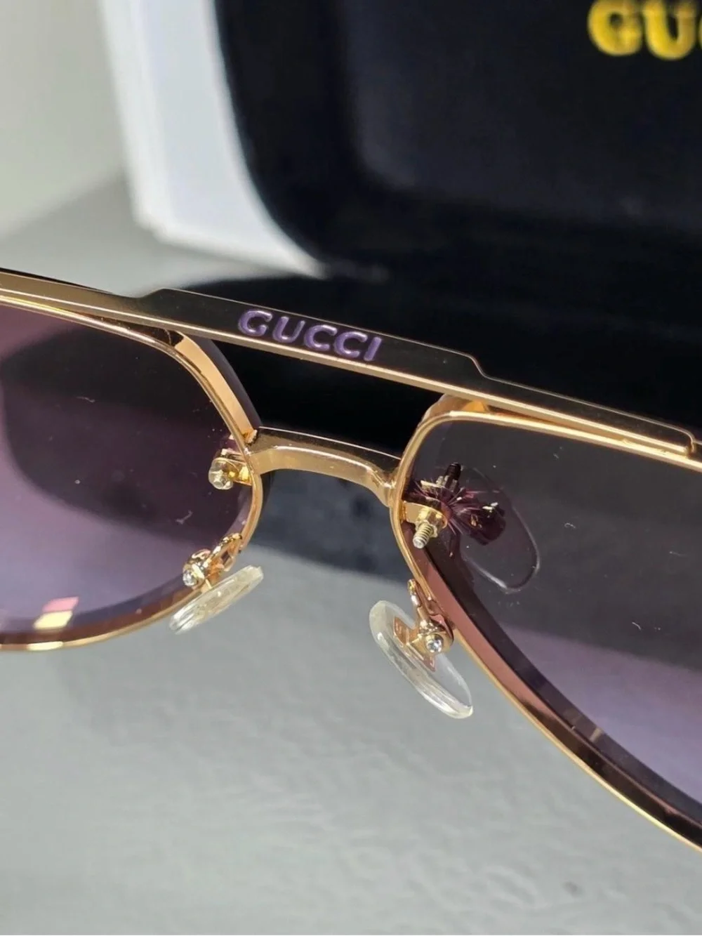 Gucci Gold Frame Sunglasses with Purple Gradient Lenses